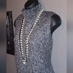 Grey knit shaded dense mock neck sleeveless sweater
